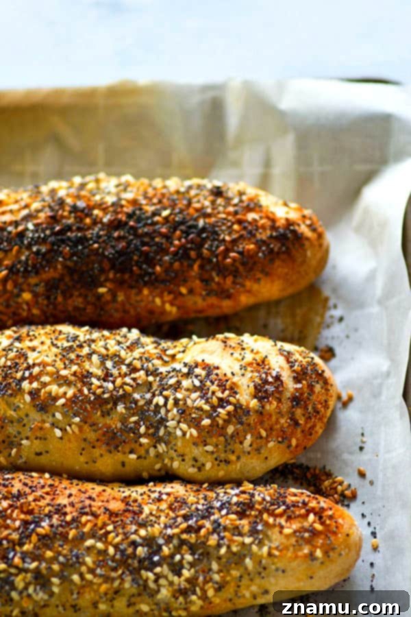 Overnight Everything Breadsticks 2 Freshly baked Everything Bagel Breadsticks cooling on a wire rack, covered generously with savory seasoning.