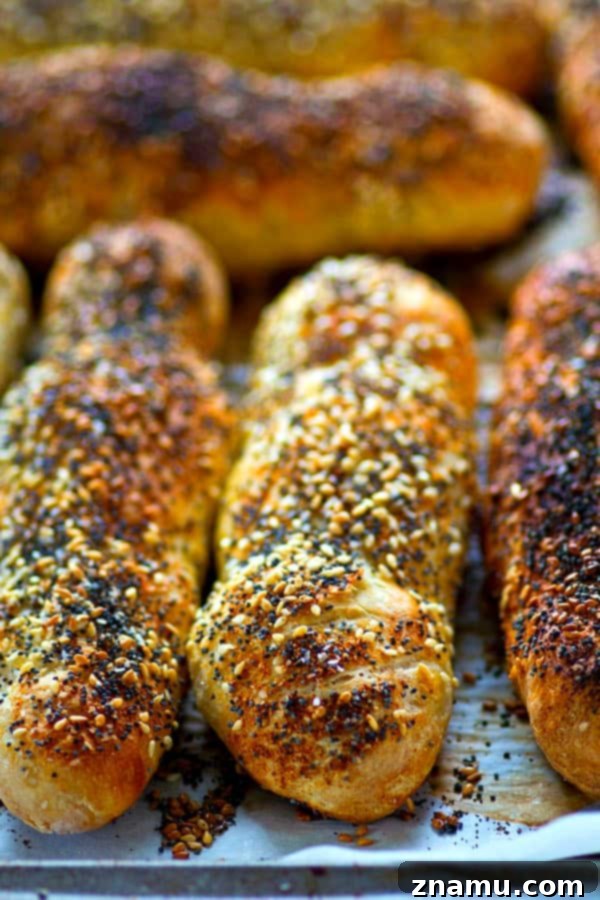 Overnight Everything Breadsticks 3 Close-up of a stack of golden brown Everything Bagel Breadsticks, showcasing the rich seasoning blend.