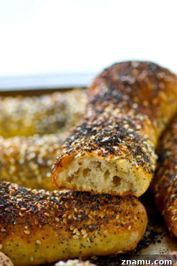 Overnight Everything Breadsticks 5 A close-up shot of the interior of an Everything Bagel Breadstick, revealing its soft, airy texture.