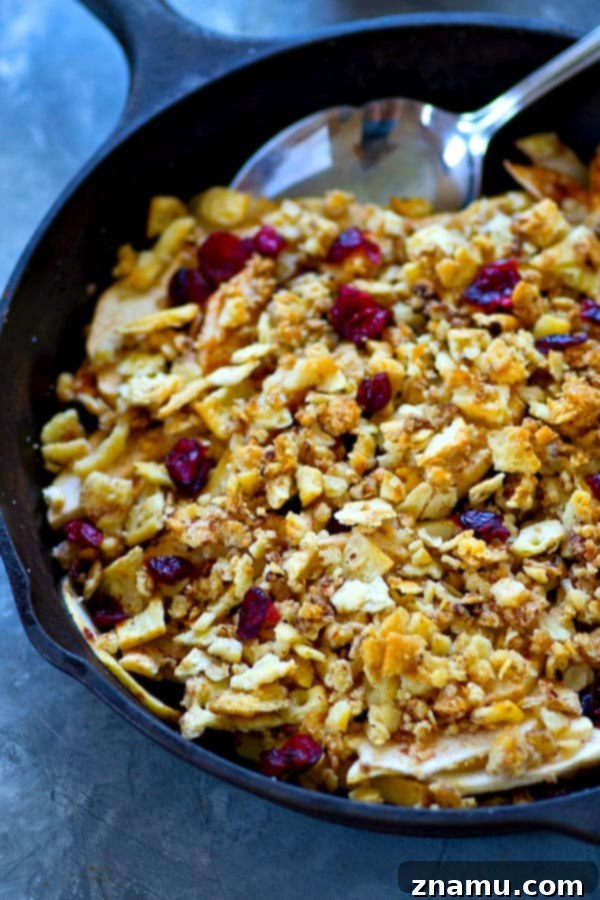 Warm Cranberry Apple Brown Betty with Spiced Chai Cream 3 A sweet apple cranberry filling is a match made in heaven with a buttery spiced cracker topping and piles of chai whipped cream on top in this classic apple brown betty!