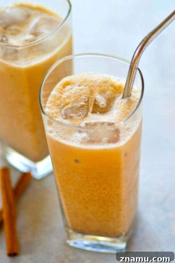 Creamy Coconut Pumpkin Spice Iced Latte 5 Serving an Iced Coconut Pumpkin Spice Latte with metal straws