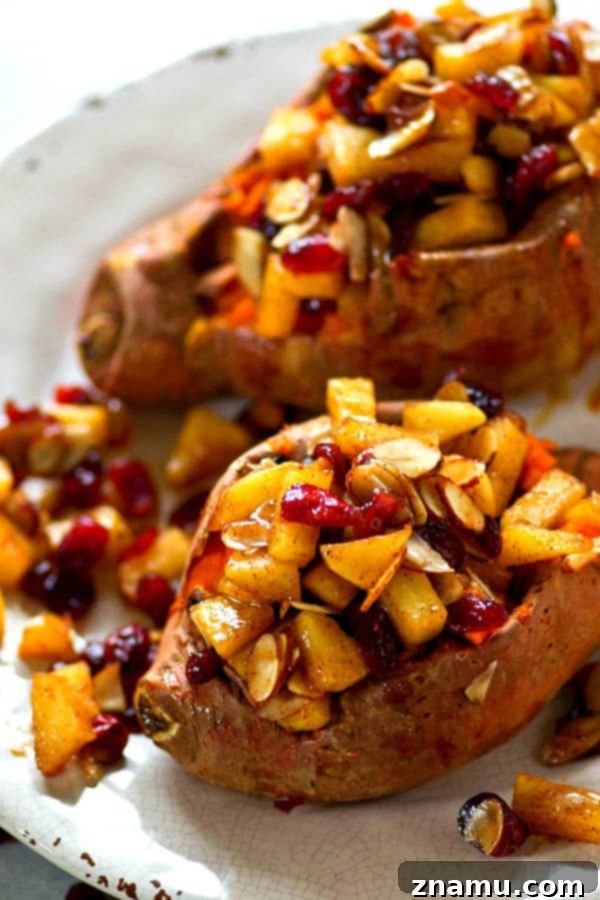 Harvest Stuffed Cranberry Apple Sweet Potatoes 5 A serving of twice-baked sweet potatoes, hot and fresh from the oven, with the filling bubbling slightly.