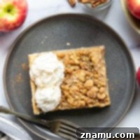 A perfectly baked apple slab pie with a golden streusel topping.