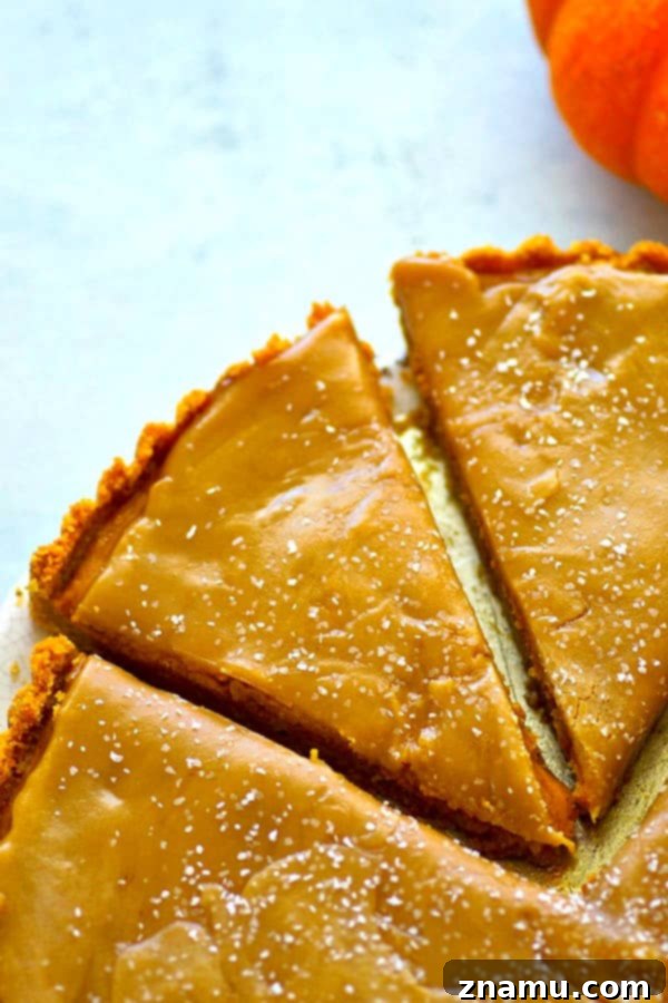 Decadent Salted Butterscotch Pumpkin Tart 2 A silky pumpkin filling sits on top of a buttery vanilla wafer crust and a homemade salted butterscotch sauce covers every inch of this INCREDIBLE pumpkin salted butterscotch tart!