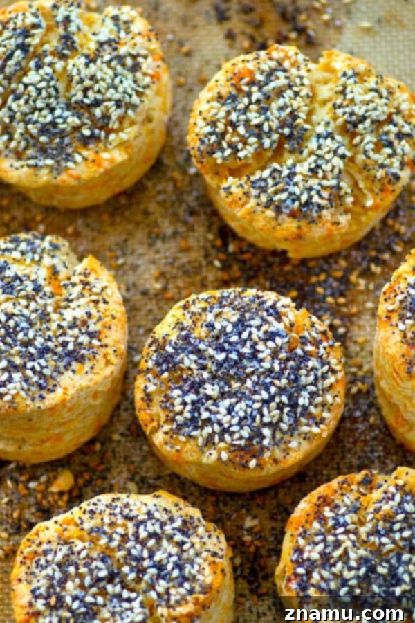 Loaded Everything Bagel Cheddar Bay Biscuits 4 Stack of freshly baked Everything Bagel Cheddar Bay Biscuits, revealing a warm, cheesy center.