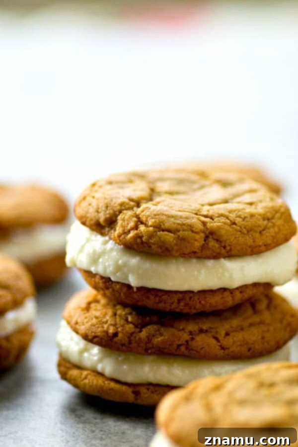 Spiced Gingerbread White Chocolate Dream Cookies 2 Soft gingerbread cookies meet a creamy white chocolate cream cheese filling in these festive gingerbread white chocolate sandwich cookies! Perfect for any cookie tray.