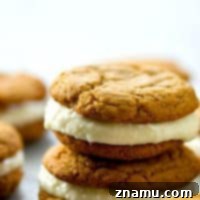 Spiced Gingerbread White Chocolate Dream Cookies 7 Soft gingerbread cookies meet a creamy white chocolate cream cheese filling in these festive gingerbread white chocolate sandwich cookies! Perfect for any cookie tray.