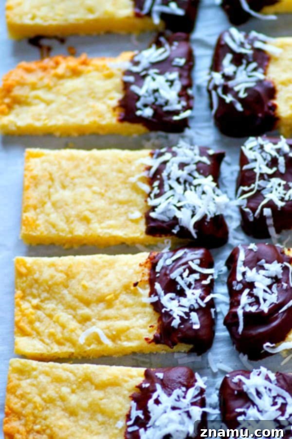 Coconut Shortbread Bars with Chocolate Drizzle 3 Soft, buttery coconut shortbread bars are dipped in melted chocolate and rolled in coconut flakes for the ultimate holiday cookie bar!