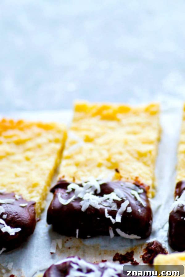 Coconut Shortbread Bars with Chocolate Drizzle 5 Soft, buttery coconut shortbread bars are dipped in melted chocolate and rolled in coconut flakes for the ultimate holiday cookie bar!