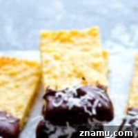 Coconut Shortbread Bars with Chocolate Drizzle 7 Soft, buttery coconut shortbread bars are dipped in melted chocolate and rolled in coconut flakes for the ultimate holiday cookie bar!