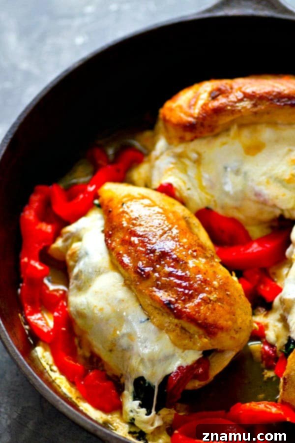 Italian-Style Stuffed Chicken with Roasted Peppers, Spinach, and Mozzarella 2 Flavorful roasted red pepper, spinach, and mozzarella stuffed chicken breasts ready to be served for an easy weeknight meal.