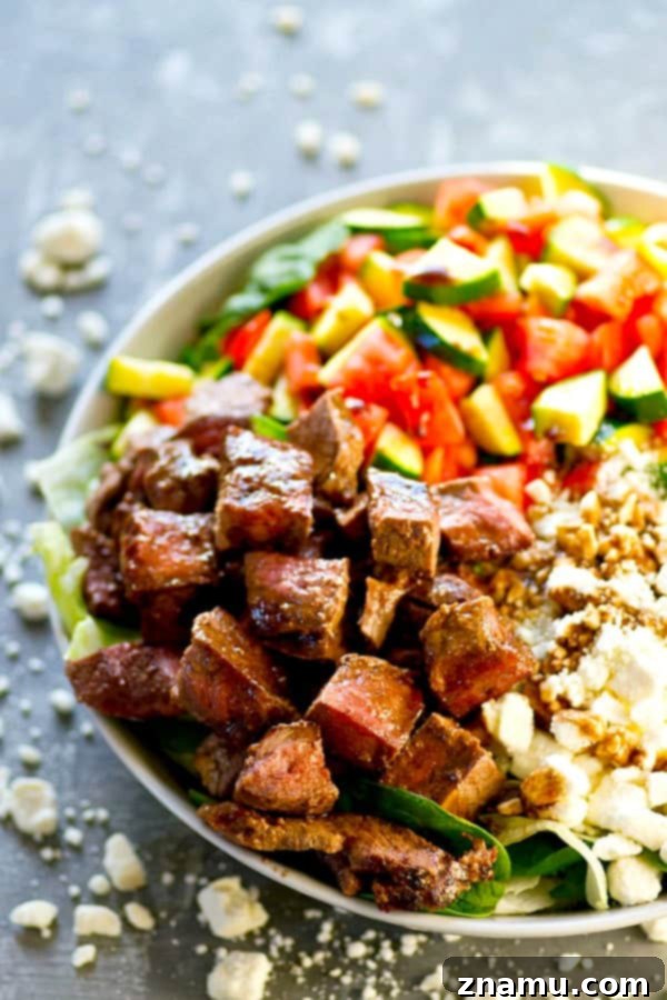 Close-up of Greek Steak Salad with vibrant vegetables and feta