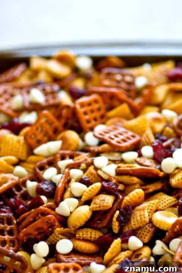 Sweet & Salty Cranberry Delight Mix 3 Sweet 'n' salty flavors pair with cranberries and white chocolate in this ADDICTING cranberry bliss snack mix! Make a big batch because it'll go fast!