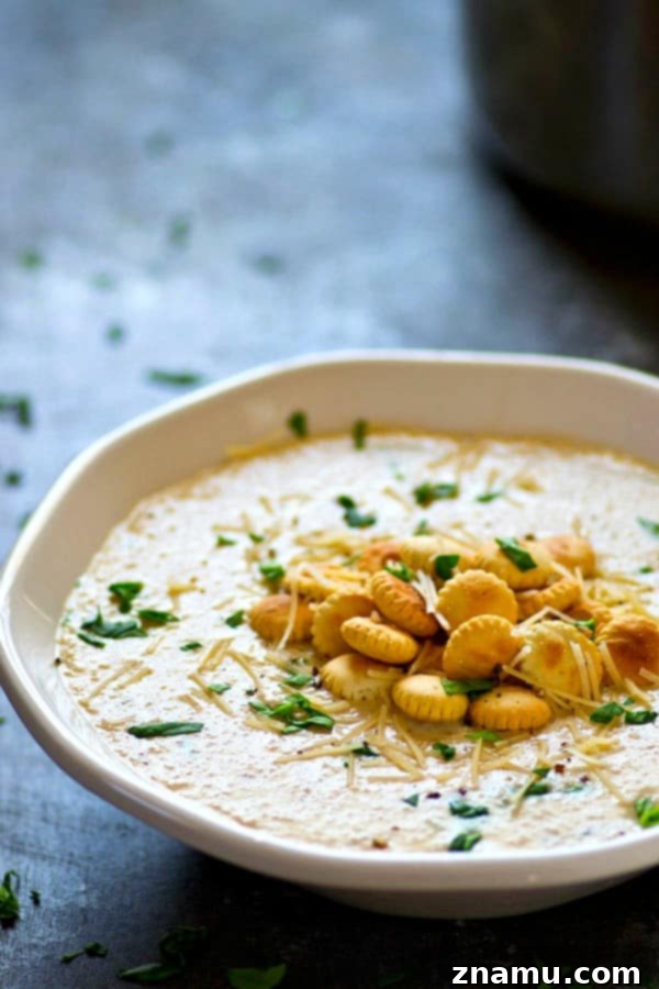 Velvety Roasted Cauliflower Parmesan Bisque 2 Insanely creamy and LOW on the calories, this roasted cream of cauliflower Parmesan soup packs a punch of cozy flavors and you'll be wanting bowl after bowl!
