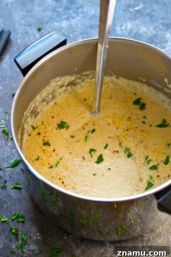 Velvety Roasted Cauliflower Parmesan Bisque 3 Insanely creamy and LOW on the calories, this roasted cream of cauliflower Parmesan soup packs a punch of cozy flavors and you'll be wanting bowl after bowl!