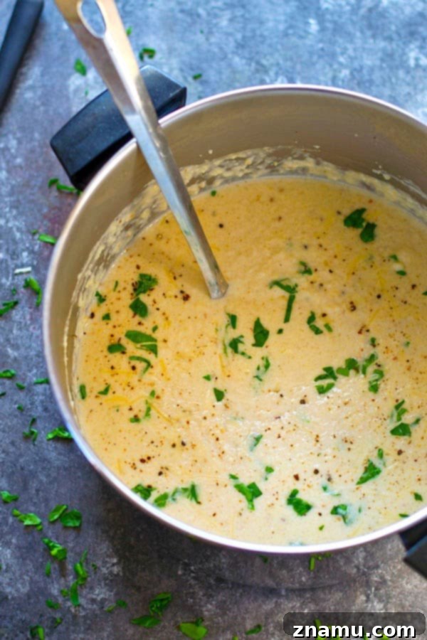 Velvety Roasted Cauliflower Parmesan Bisque 5 Insanely creamy and LOW on the calories, this roasted cream of cauliflower Parmesan soup packs a punch of cozy flavors and you'll be wanting bowl after bowl!