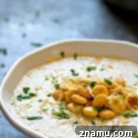 Velvety Roasted Cauliflower Parmesan Bisque 7 Insanely creamy and LOW on the calories, this roasted cream of cauliflower Parmesan soup packs a punch of cozy flavors and you'll be wanting bowl after bowl!