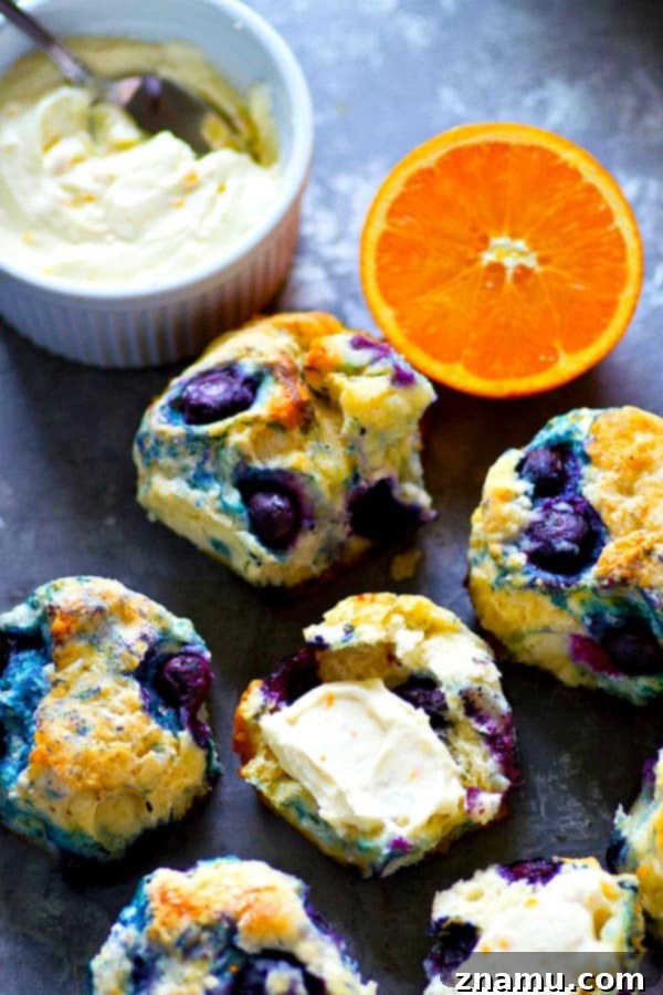 Coconut-Kissed Blueberry Biscuits with Sunny Orange Cloud Cream 2 Tender, flaky coconut oil blueberry biscuits with juicy blueberries and orange whipped cream cheese.