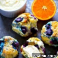 Coconut-Kissed Blueberry Biscuits with Sunny Orange Cloud Cream 7 Coconut oil blueberry biscuits are tender, flaky, and exploding with juicy blueberries! Slather them up with orange whipped cream cheese hot out of the oven for the ultimate breakfast!