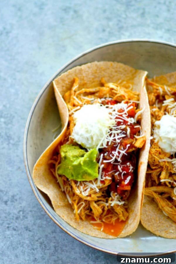Instant Pot Shredded Taco Chicken 2 Homemade taco seasoning and a quick cook in the instant pot are the secrets behind this INCREDIBLY tender and flavorful taco shredded chicken! Perfect for topping tacos and salads!