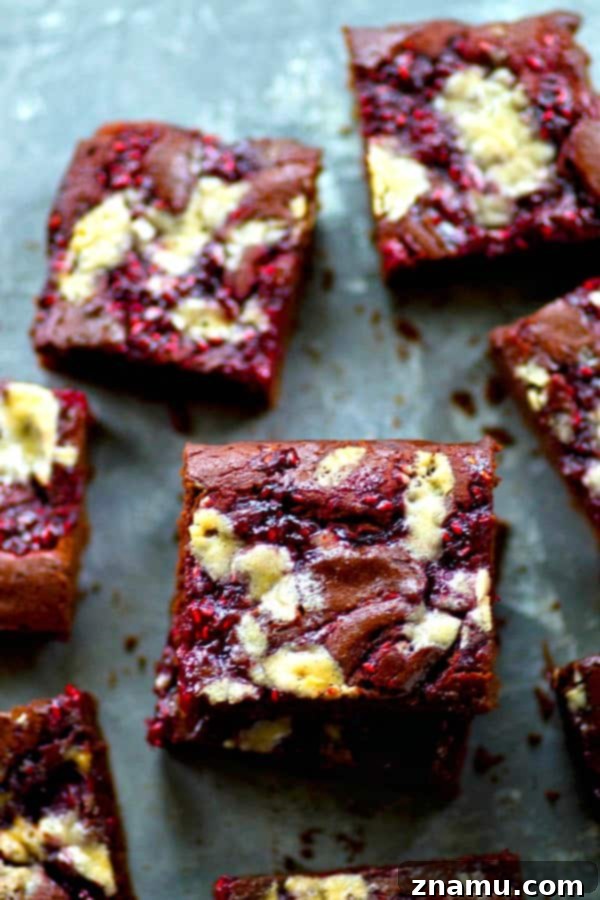 White Chocolate Raspberry Marbled Brownies 4 A tray of freshly baked white chocolate and raspberry jam swirled brownies cooling, ready to be cut into squares