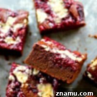 White Chocolate Raspberry Marbled Brownies 6 Ultra fudgy raspberry jam swirled brownies are swirled with a homemade raspberry jam and tons of white chocolate for the ultimate romantic brownie!