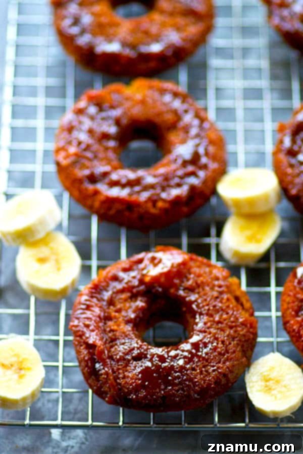Sticky Caramel Banana Bread Bites 3 Close-up shot of a single caramel upside-down banana bread donut, showcasing its soft texture and the rich, golden caramel topping.