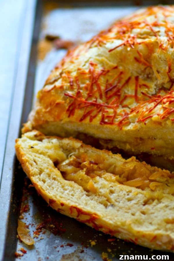 Artisan Caramelized Onion Asiago Loaf 3 Flavorful caramelized onion and sharp asiago cheese are the perfect duo in this stunning asiago no-knead bread! Its made overnight for easy baking the next day and SO incredibly tender and flavorful!