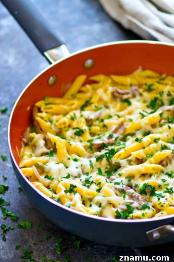 Single-Skillet Philly Cheesesteak Penne 3 Close-up of creamy Philly Cheesesteak Penne Pasta with melted provolone cheese and fresh parsley