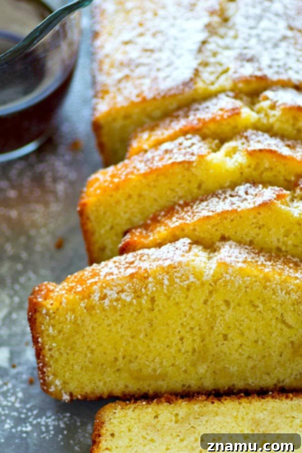Velvet Espresso Pound Cake 4 Espresso Pound Cake, lightly dusted with powdered sugar, sitting on a cooling rack, radiating warmth and flavor