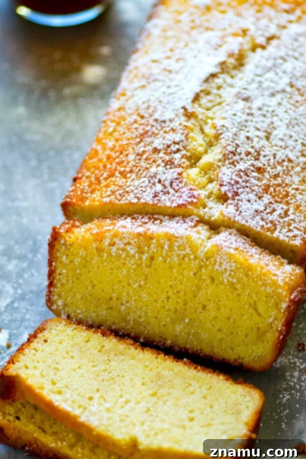 Velvet Espresso Pound Cake 5 A close-up of a slice of Espresso Pound Cake, showing its dense crumb and inviting color, ready for serving on a white plate