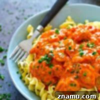 Authentic chicken paprikash served with garlic butter noodles.