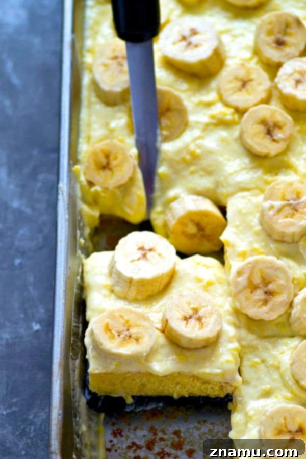 Dreamy Banana Cream Sheet Cake 3 Close-up of creamy banana pudding on yellow cake base