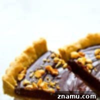 Indulgent Peanut Butter Chocolate Tart 7 A rich chocolate ganache filling and a soft, chewy peanut butter cookie crust are the most INSANE combo in this luscious chocolate ganache tart.