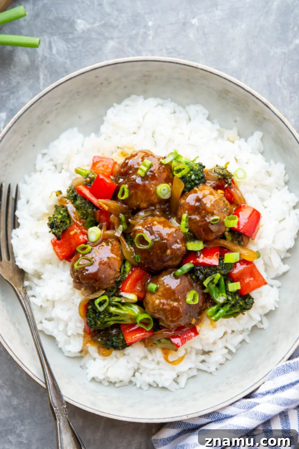 Mongolian Glazed Beef Bites 2 Tender Mongolian Beef Meatballs with vibrant sautéed vegetables, prepared in a single skillet.