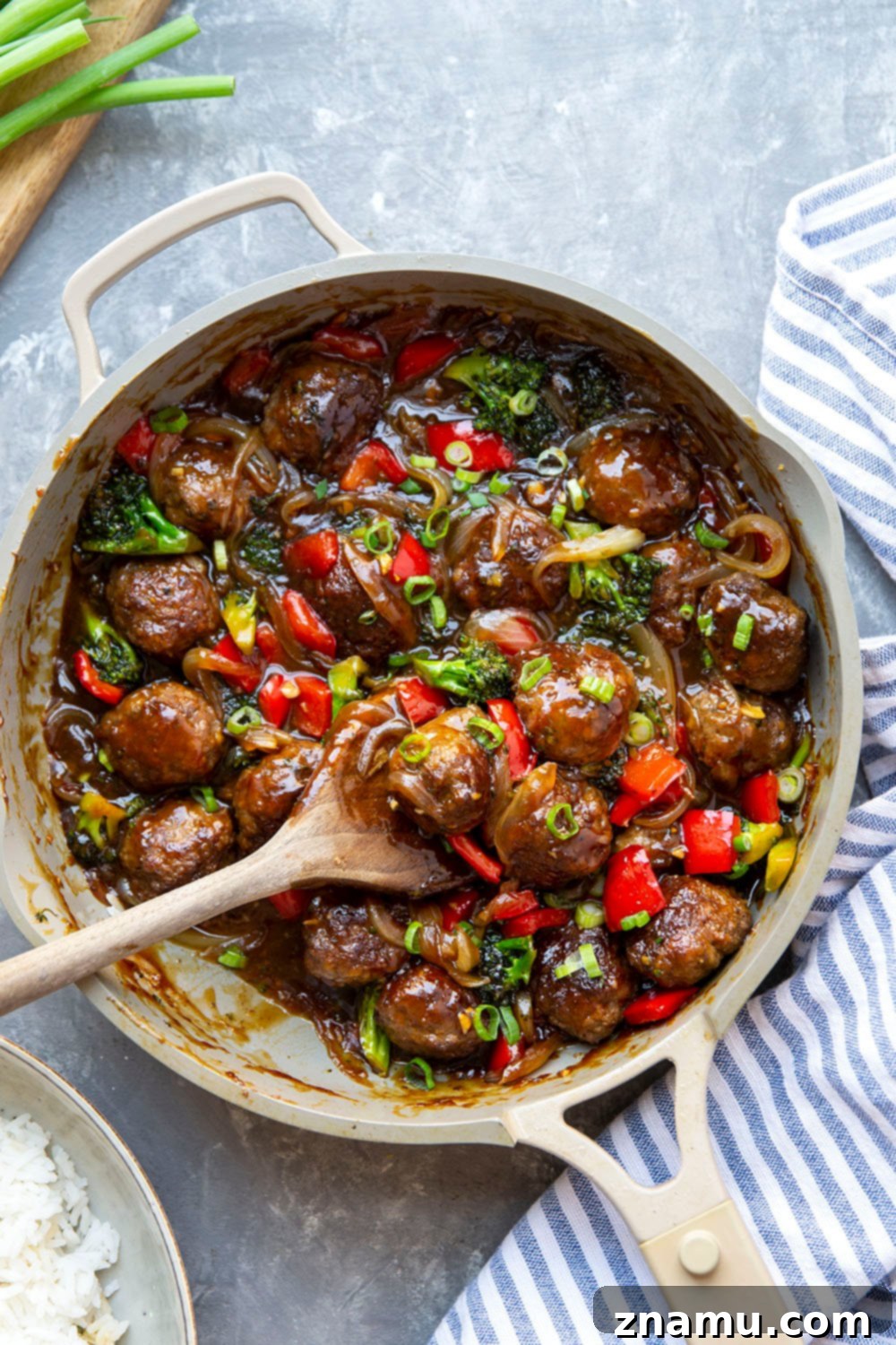 Mongolian Glazed Beef Bites 5 Hand shaping ground beef into uniform meatballs.