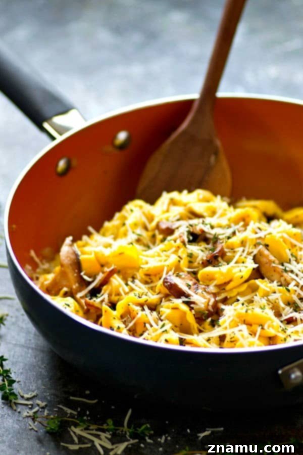 Finished garlic butter Asiago tortellini skillet, ready to be served.
