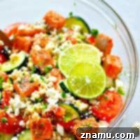 Greek Seared Salmon Couscous Salad with fresh ingredients
