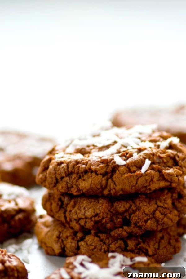 Fudgy Coconut Chocolate Cookies 5 Freshly baked coconut chocolate fudge cookies cooling on a wire rack.