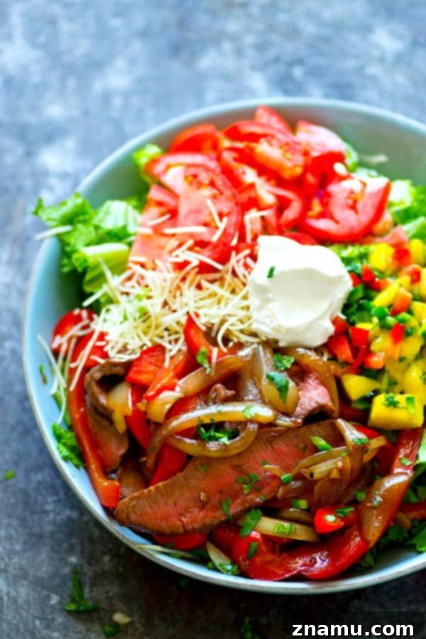 Spiced Beef Fajita Salad with Tropical Mango Pico de Gallo 2 Tender grilled beef fajita salad with vibrant mango pico de gallo