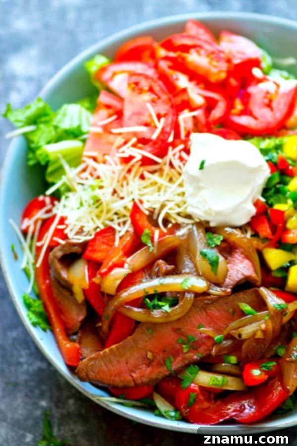 Spiced Beef Fajita Salad with Tropical Mango Pico de Gallo 4 Close-up of grilled beef fajita salad ingredients