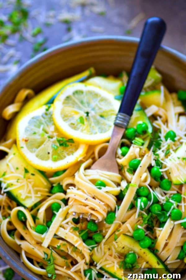 Bright Lemon Parmesan Fettuccine with Zucchini Ribbons and Spring Peas 2 Bright Lemon Parmesan Fettuccine with fresh zucchini ribbons and sweet peas, ready to be served.
