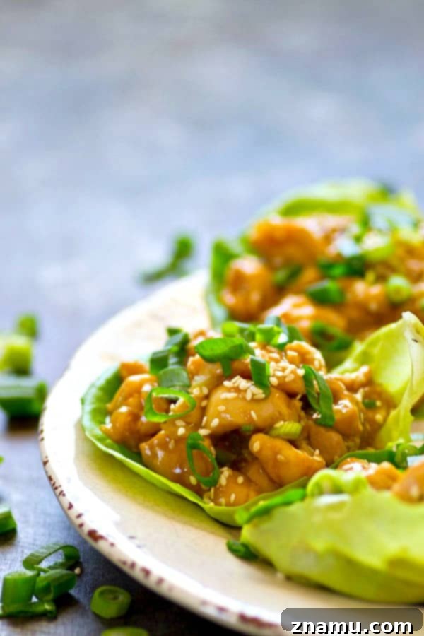 Sticky Sesame Honey Garlic Chicken Lettuce Wraps 4 A sweet, sticky homemade sesame honey sauce coats EVERY inch of these loaded honey garlic chicken lettuce wraps! You can make them WAY ahead of time for easy lunches.