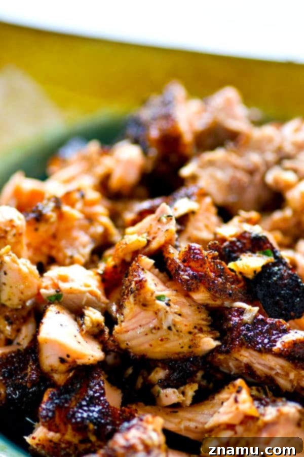 A smokey homemade jerk seasoning coats every inch of these jerk grilled salmon tacos that are heaped in soft flour tortillas and piled high with tangy avocado pineapple salsa!