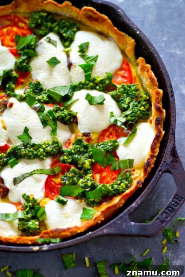 Skillet Caprese Quiche with Basil Pesto Sausage 2 A fresh homemade basil pesto and all the caprese fixins' are a match made in brunch heaven in this skillet basil pesto sausage caprese quiche! Cut BIG slices of this luscious quiche for best results.