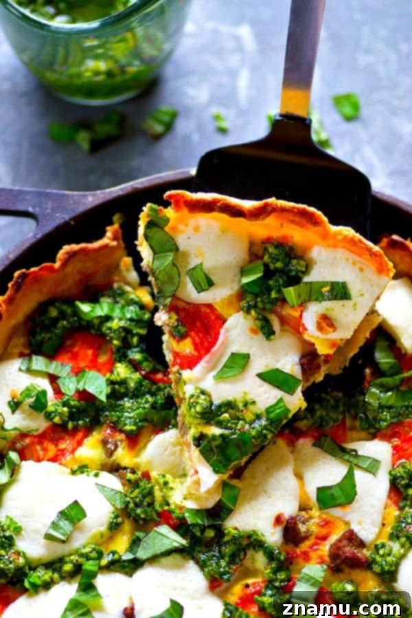 Skillet Caprese Quiche with Basil Pesto Sausage 4 A fresh homemade basil pesto and all the caprese fixins' are a match made in brunch heaven in this skillet basil pesto sausage caprese quiche! Cut BIG slices of this luscious quiche for best results.