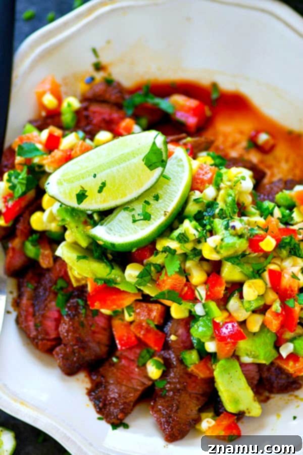 A spicy homemade blackened seasoning coats every inch of this grilled blackened steak that's served with a zippy charred corn avocado salsa piled over top!