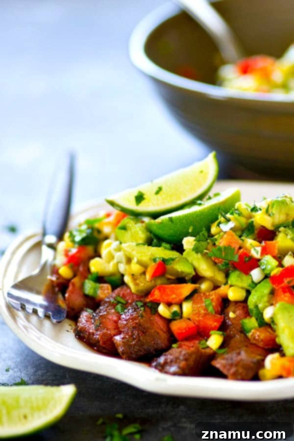A spicy homemade blackened seasoning coats every inch of this grilled blackened steak that's served with a zippy charred corn avocado salsa piled over top!