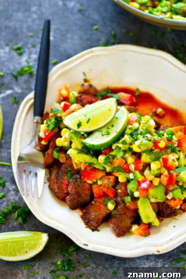 A spicy homemade blackened seasoning coats every inch of this grilled blackened steak that's served with a zippy charred corn avocado salsa piled over top!