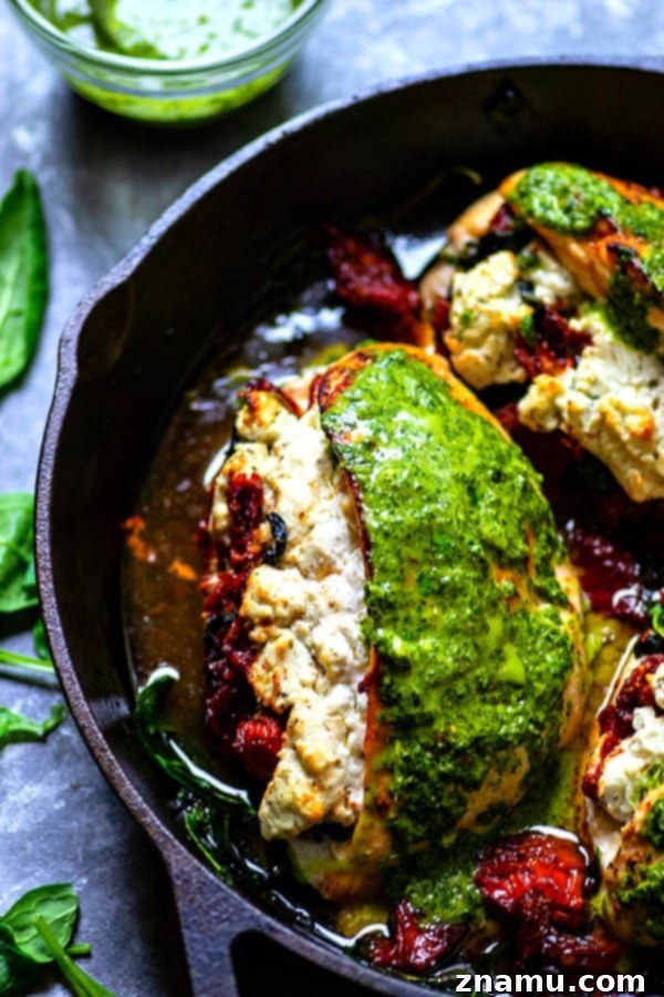 Chimichurri-Drizzled Chicken with Sun-Dried Tomato and Goat Cheese Stuffing 3 Close-up of perfectly stuffed chicken breasts, showcasing the rich filling before baking.